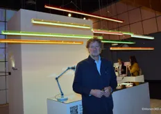 Anton de Groof from Tonone, posing with The Bridge, a linear LED lamp that allows for a graphic interplay of lines and enables experimentation with composition.