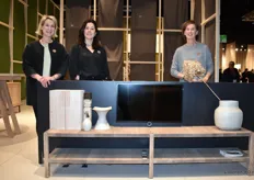 Marlies van der Werff, Annelies Pilat, and Carin Rijpstra (from left to right) from Pilat&Pilat, a Frisian manufacturer of solid wood design furniture, posing with the new wall unit Wies.