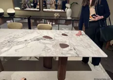 With this table, you can see the table legs reflected in the tabletop.