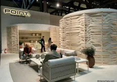 The stand had been completely revamped, featuring woven wood in both the standards and the chairs.