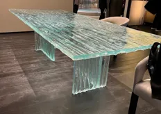 Beautiful creation of a completely glass table that looks like frozen glass.