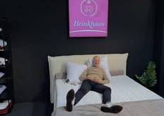 Arjan den Ouden of Lots of Textiles, the Benelux agent for Brinkhaus, posed on a bed featuring pillows and a duvet from the German brand.”