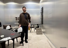 Designer Cezar Moldovan with his Luna table designed for Arbore.