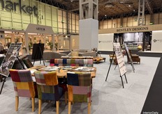 At the heart of Hall 1, visitors can explore diverse designs featuring various fabric options on one product, with standing boards offering detailed insights.