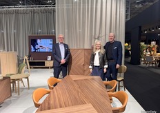 From left to right at PBJ Design Aps stand: Peter Bo Hansen, Anette Svendsen, Morten Svendsen, showcasing unique wood grain design and a central open square on the cabinet.