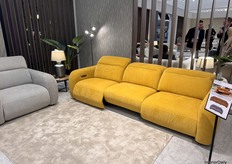 The Oslo collection shines in vibrant colors with a 4-seater power recliner couch featuring full automatic functionality.