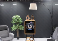 Prusa showcased its 3D printers designed for architects and designers, featuring a limited edition model crafted with real oak for enhanced aesthetic appeal.