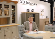 Peter Peovici posed with the new chic Oak Collection at the XO Interiors booth.