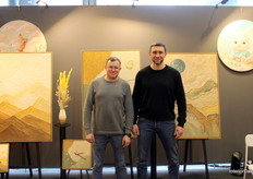Alexander Merker, CEO of YS - Art (right),  showcased his hand-painted artworks with his sales agent.