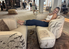 Sally Harrison from Casamento Design demonstrating how playful and inviting the new sofa is designed by founder, Starry-Eve Colette, this sofa allow you to put your feet up and just relax.