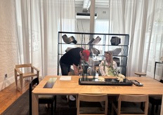 A representative from Muvek explaining to a client the qualities of Muvek furniture range and the specifications and dimensions at the Muvek showroom in Cape Town.