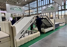 A visitor is looking at the sleep storage systems from Mr. Sleep.