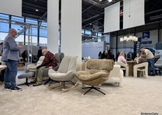 The wide, comfortably seated armchairs were seen frequently at the fair, upholstered in soft, touchable fabrics.