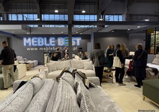 A look inside the busy booth of Meble Best from Poland.
