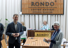 At Rondo’s stand, CEO Marcin engaged with visitors, here pictured with one attendee exploring the brand’s offerings.