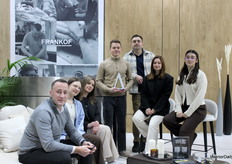 The team of Frankof posed together, proudly holding the award for one of the Best Booths at Meble Polska.