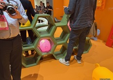 SLIDE’s colorful hexagon-shaped cabinet.