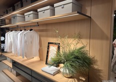 HC28 Maison’s closet collection, integrated with the bedding displayed on the back wall to showcase a fully functional room setup.