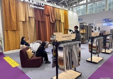 AGMAMITO’s stand at CIFF, featuring rows of fabrics and colors to admire.