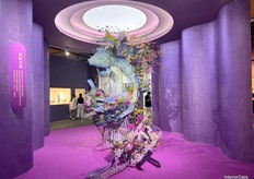 A colorful display combining hues, wood, and flowers, creating an eye-catching presentation.