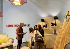 Christopher Reiter in conversation with visitors at the stand of Kenneth Cobonpue.