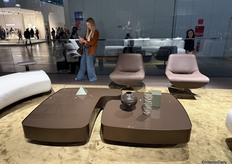 Mocha-colored coffee tables in organic shapes that can be placed separately or combined into one whole.