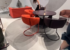 Tecta's usage of late 1900's design with a modern touch by usage of soft fabric and steel frames.