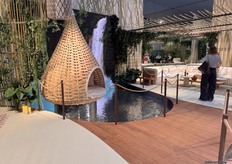 DEDON used a screen and reflective decoration to give an effect of real water throughout their stand.