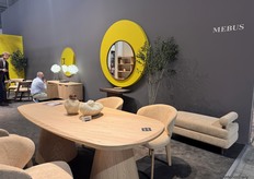 Mebus took part in the exhibition, presenting a collection that blended wall decoration with new wooden tables and chairs dressed in warm fur accents.