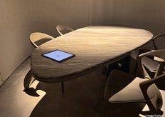 The flagship dining table by Mezea, including its accompanying chairs, was presented.