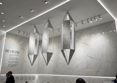 Optimum presented “The Crystals,” featuring three monumental crystal structures hanging above the stand.