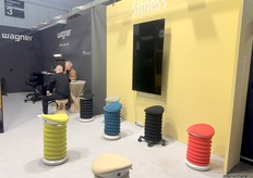 Sitness’ booth shown from another angle, with Wagner’s newest office and chair designs visible in the back.
