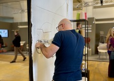 So there was also a craftsman tufting a rug live.