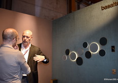 Jeroen Kuiper (right) from Basalte in conversation with a visitor. On display were multifunctional design keypads, refined speakers, and elegant iPad holders.