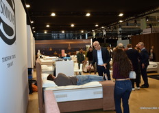 Jean-Pierre Willems, district manager of Simmons - Sleepeezee, busily gestures and explains to a testy visitor.