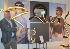 Karl Stok, Sales Director Netherlands, of TRIO Lighting Group poses with the Cisenna collection of the exclusive Cinque brand, one of the three high-end brands the company carries.