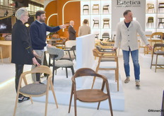 Carla and Marco Barbuio (right) of BXB Interior Collections represent Estetica Home's wooden chairs.