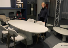 Louise Vandenbroucke at the Taviro table with matching chairs by Rousseau.