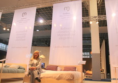 Co-owner Liesbeth Claesen poses with the Hevea collection of Furniture Factory Jooken.