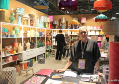 Hilda van Hall poses (right) and Else Schaap helps a visitor with Madame Garage's new collection of lamps.