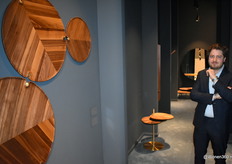 Andreas Deklerck of Per/Use, posing at innovative design objects.