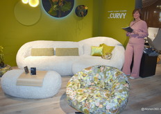 Agent Anne-Marie van Esterik of HADU Meubelen BV of Lienden at the new sofa Curvy by Koinor, which brand she represents in the Netherlands.